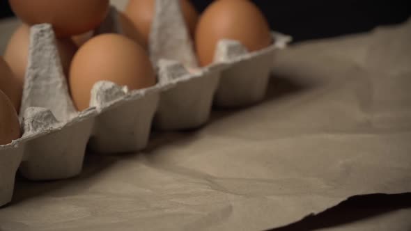 Chicken Egg is Rolling Near the Container