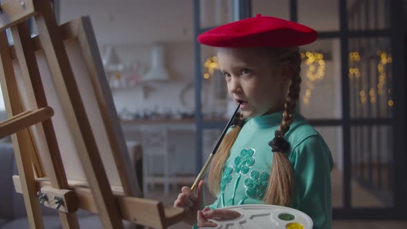 Inspiring Little Artist Thinking About Painting