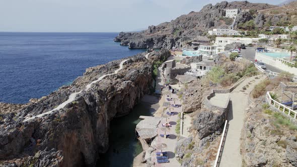 Drone footage of the Kalupso village blue logons, coral reefs, rocky hills. Mediterranean paradise.