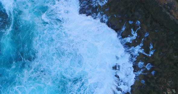 Aerial view of the waves at the lighthouse at Punta Torrencilla at the mouth of the Rio Ozama and th