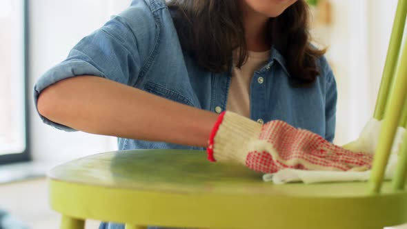 Woman Applying Solvent to Rag at Home