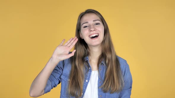 Talking Video Chat By Pretty Woman Isolated on Yellow Background