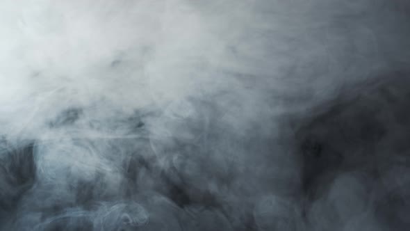 Smoke texture over blank black background. Mystical steam at night.