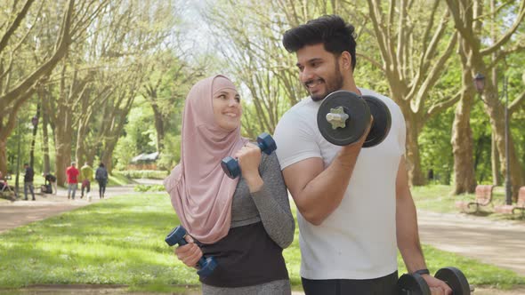 Happy Young Arabian Couple in Sport Clothes Having Morning Workout at Summer