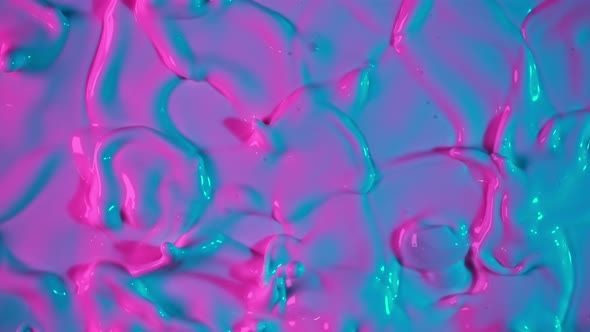Super Slow Motion Abstract Shot of Swirling Neon Liquid at 1000Fps alt