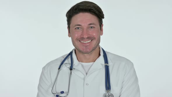 Male Doctor Smiling at Camera, White Background