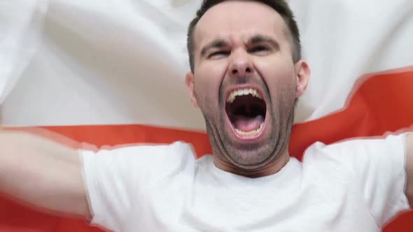 Polish Fan Celebrates Holding the Flag of Poland