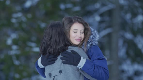 Two girls hugging alt