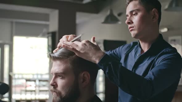 Barber Cutting Man’s Hair