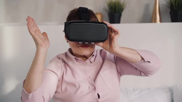 Adult Woman Is Sitting and Using Glasses of Vr Digital Technology, 3d Display Simulation.