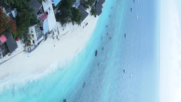 Vertical Video of the Ocean Near the Coast of Zanzibar Tanzania Aerial View