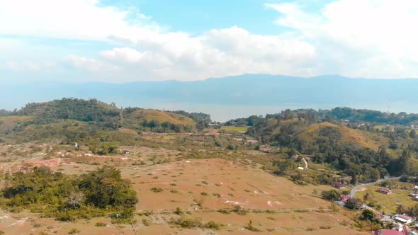 Aerial: lake Toba and Samosir Island view from above Sumatra Indonesia. Huge vol