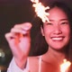 Young asian woman with sparklers is dancing and celebrating a new year. Fireworks, - VideoHive Item for Sale