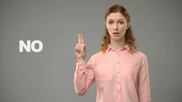 Lady Saying No in Sign Language, Text on Background, Communication for Deaf