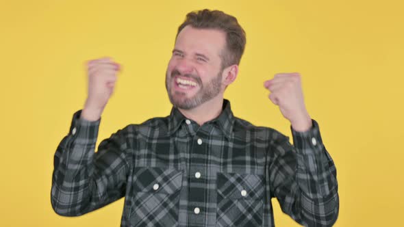 Portrait of Excited Middle Aged Man Celebrating Success