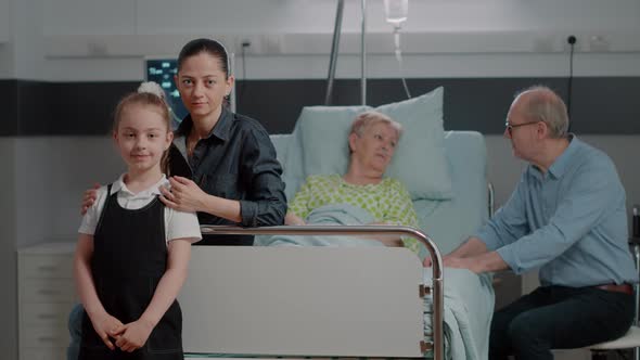 Portrait of Mother and Child Sitting in Hospital Ward at Family Visit