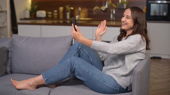Positive Young Woman Using the Smartphone for Video Call