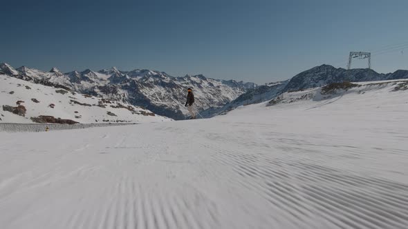 Woman In Skiwear Standing In Skis On Slope