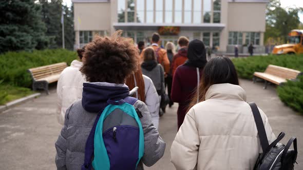 Group of Multiethnic Students Walking to School