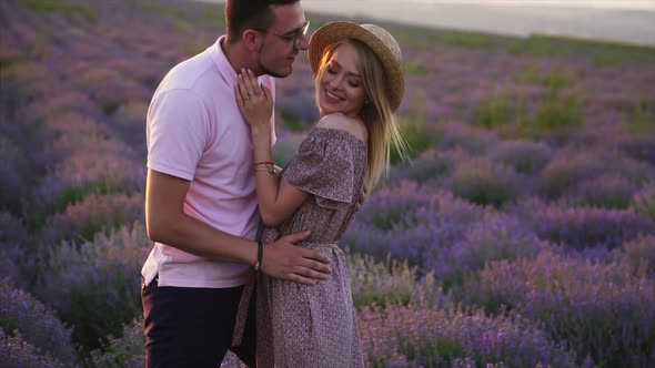 Young Couple Kisses in Flowering Lavender Field, Slow Motion