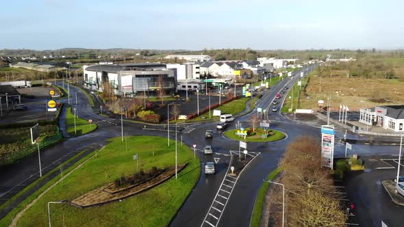 Aerial - Flying above the traffic on a roundabout in smalltown of Carrick-on-Shannon, Ireland, Europ