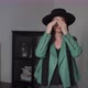 Young Woman Put on Green Leather Jacket and Hat - VideoHive Item for Sale
