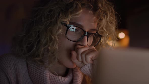 Close up video of tired woman during video conference. Shot with RED helium camera 