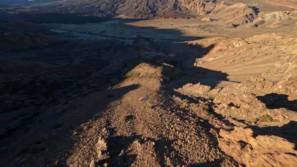 Cliff Rock and Mountain Surfing with a FPV Drone in a Desert and Moon Like Sandy and Rocky Landscape