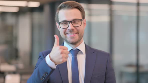 Portrait of Businessman showing Thumbs Up Sign