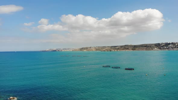 Aerial view Fish Farms in calm, blue Mediterranean sea Mellieha,Malta