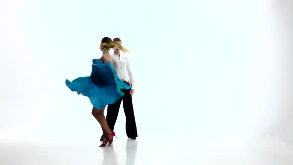 Samba Dancing Couple of Professional Elegant Dancers,slow Motion. White Studio