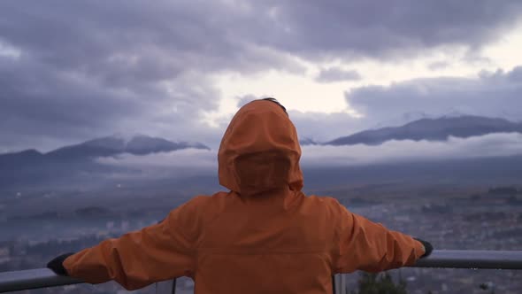 Young Man Watching Razlog City Panoramic View From High Balcony