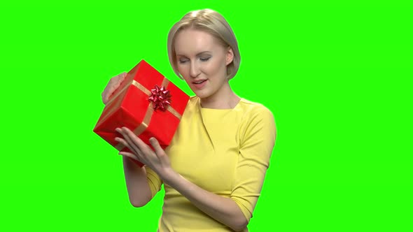 Adorable Caucasian Woman Hugging Red Gift Box