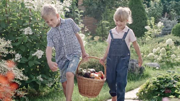 Children with Basket Full of Harvest