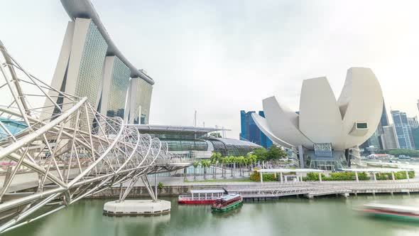 View of The Helix Bridge in Singapore Evening Timelapse alt