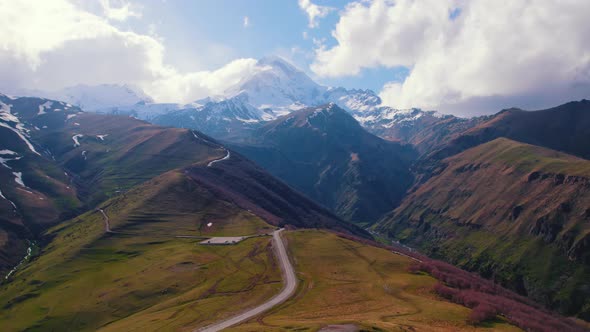 Aerial View of Winding Road in the Caucasus Mountains Stepantsminda MtskhetaMtianeti Region Georgia