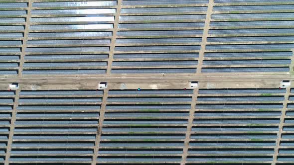 Aerial Top Down View of Solar Power Station Field at Sunny Day. Aerial Top View of Solar Farm