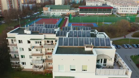 Drone Shot on Modern Multiapartment Buildings with Solar Panels on the Roofs