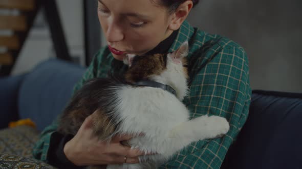 Affectionate Woman Showing Warm Feeling To Adopted Cat