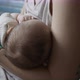 Young Woman Feeds Breast Milk to Her Newborn Baby Closeup - VideoHive Item for Sale