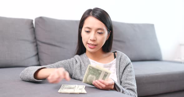 Woman counting the banknote