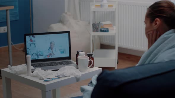 Patient with Headache Using Video Call for Telemedicine