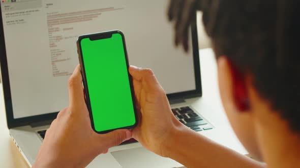 African American Man Using Smartphone with Chroma Key Closeup