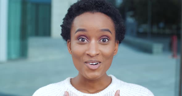 Close-up Female Face Shocked Emotions Afro American Girl with Ideal Makeup and Eyes Wide in Surprise