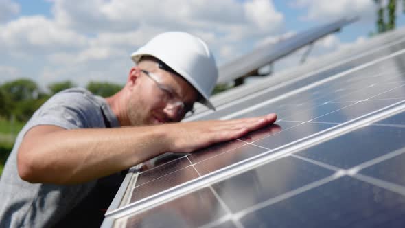 Close Up of an Young Engineer Hand is Checking an Operation of Sun and Cleanliness of Photovoltaic