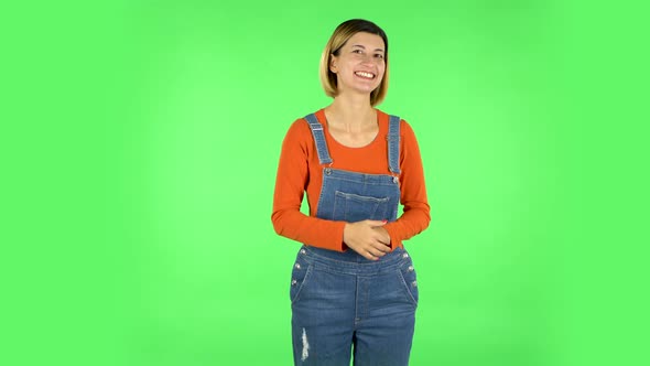 Young Cheerful Woman Showing Thumbs Up, Gesture Like. Green Screen