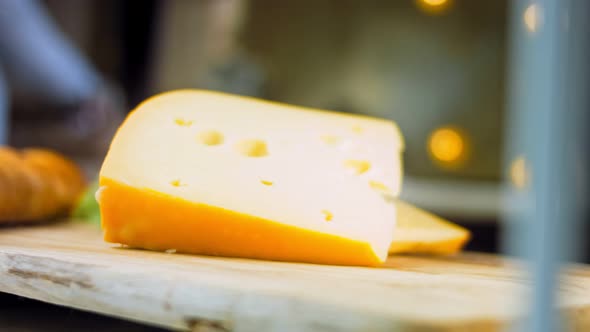 Cheese with Holes on a Retrostyle Cooking Tray