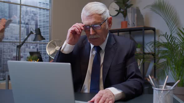 Tired Sad Senior Old Business Man Showing Upset Emotion After Unsuccessful Online Deal with Client