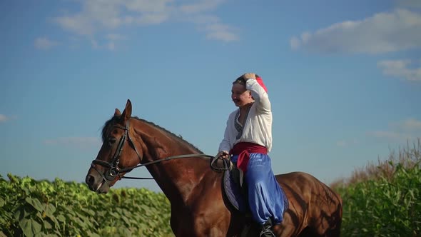 Ukrainian Cossack Riding a Horse in the Field Looks Far