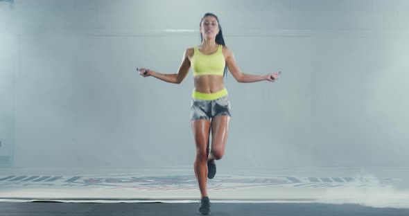 Athletic Muscular Woman Jumping Rope
